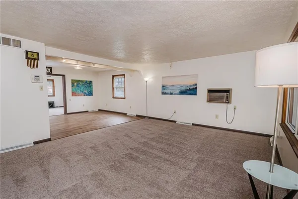 a bathroom with a sink a toilet and shower curtain