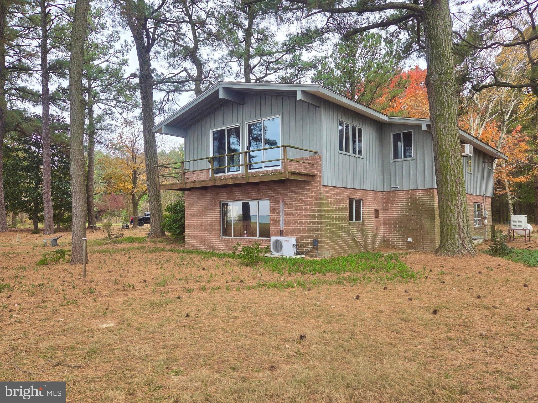 5489 Rude Avenue Tilghman, MD 21671 - Photo 15 of 65 a house that has a lot of windows in it