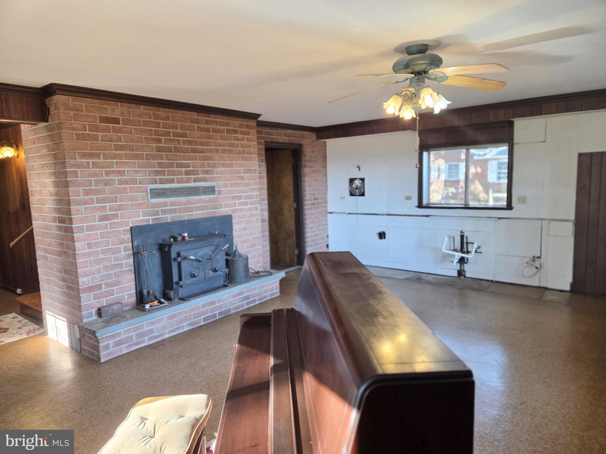 5489 Rude Avenue Tilghman, MD 21671 - Photo 25 of 65 a living room with furniture and a fireplace