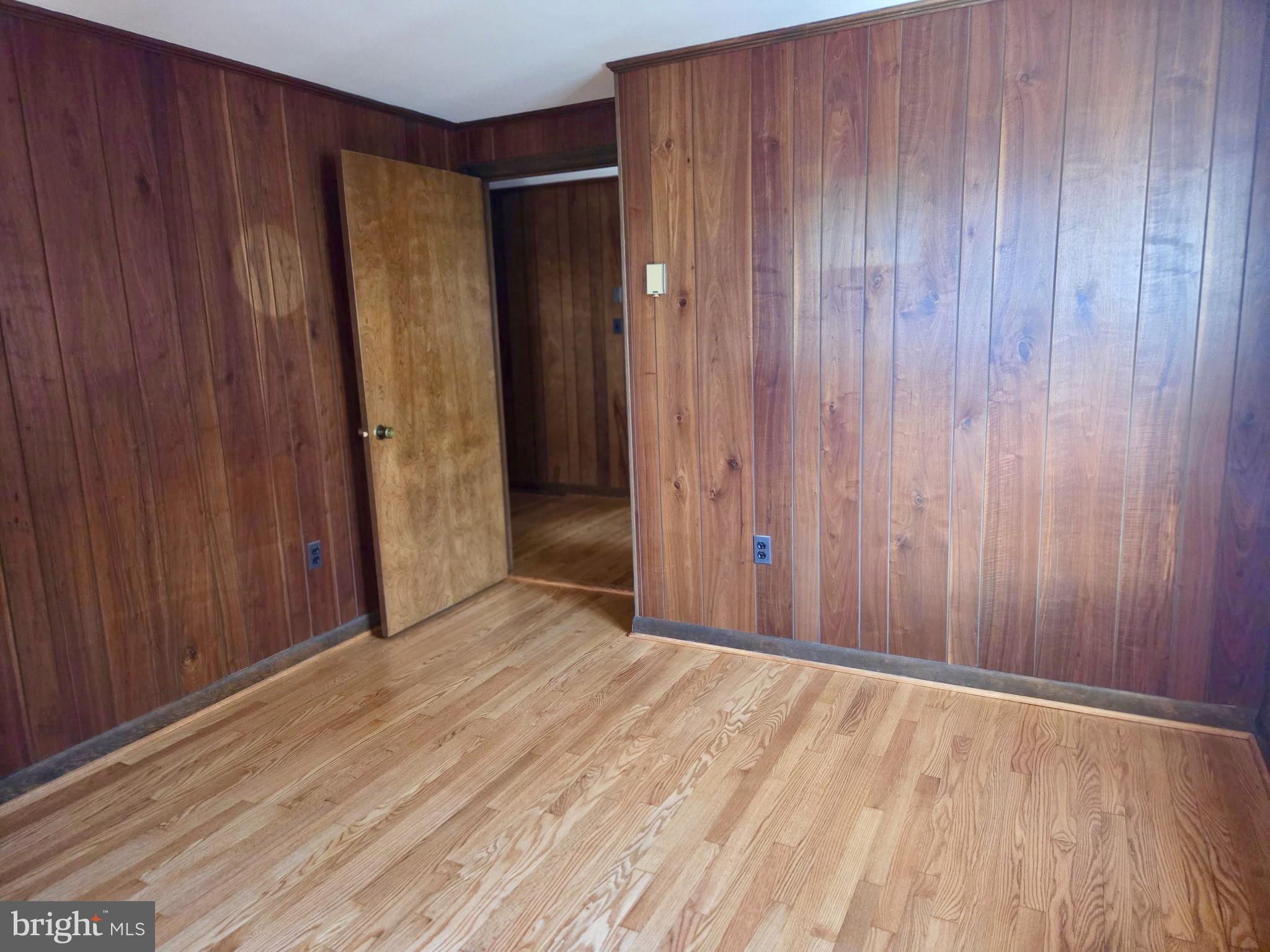 5489 Rude Avenue Tilghman, MD 21671 - Photo 30 of 65 a view of an empty room with wooden walls