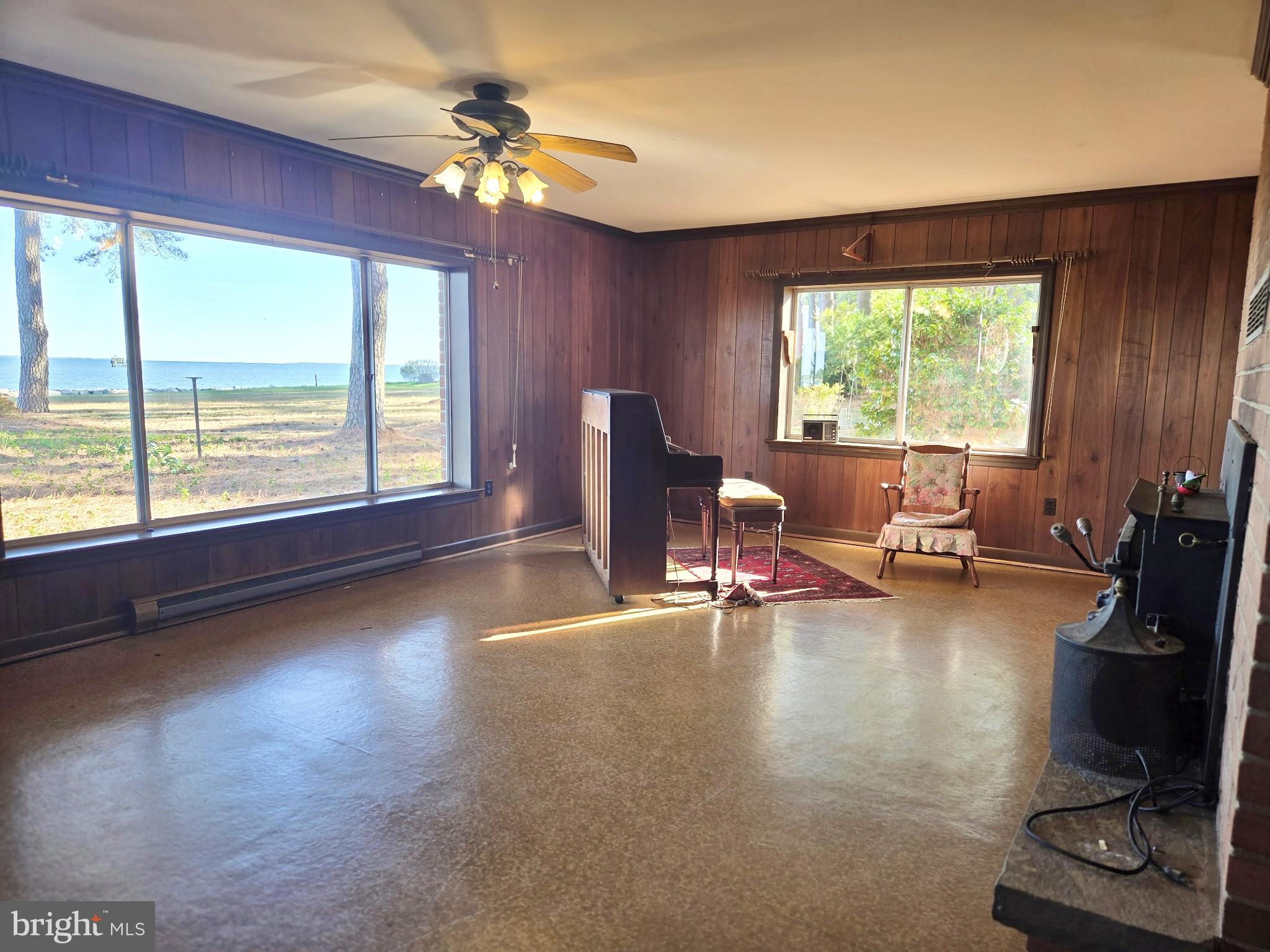 5489 Rude Avenue Tilghman, MD 21671 - Photo 37 of 65 a living room with furniture and a large window