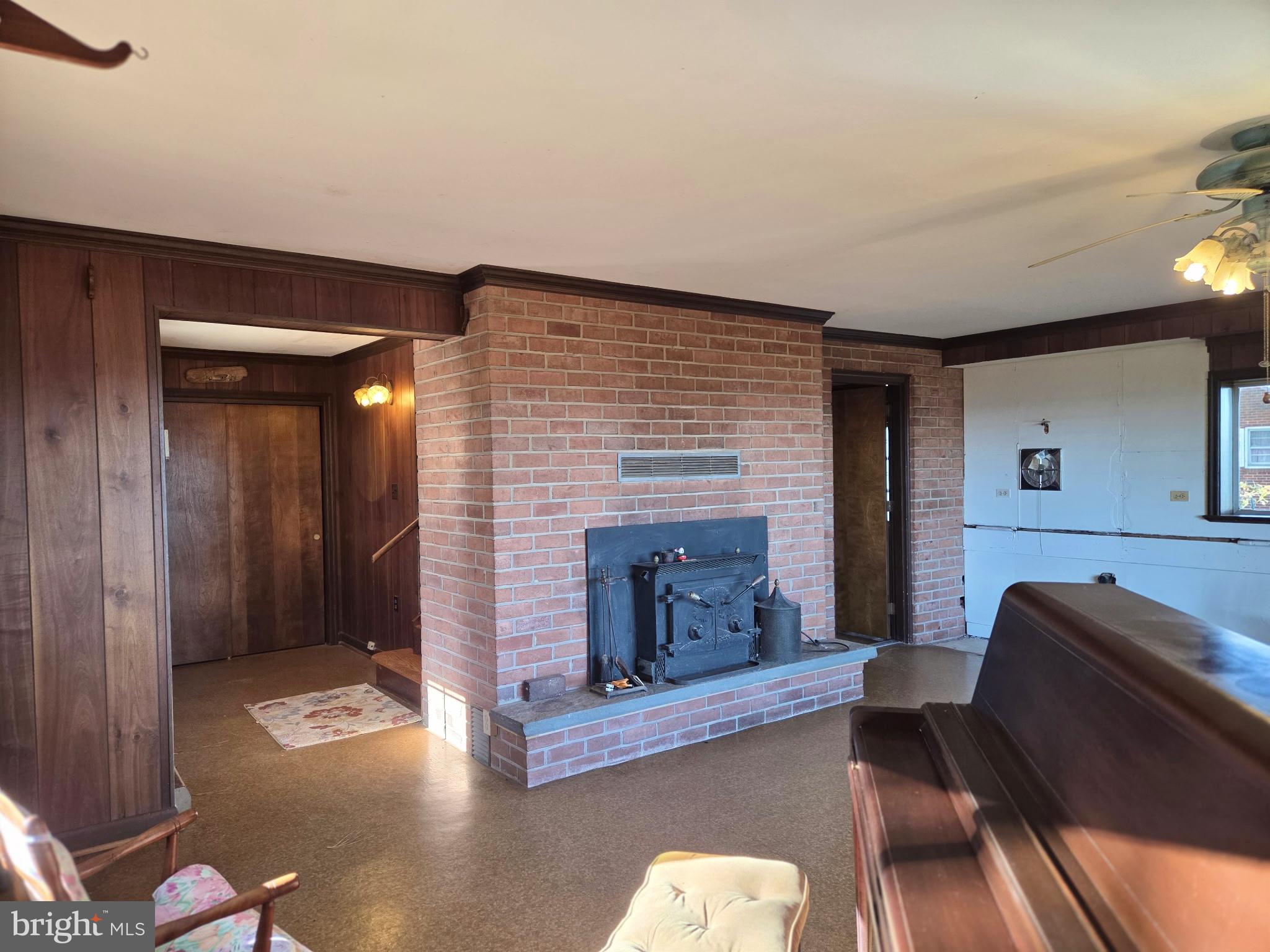 5489 Rude Avenue Tilghman, MD 21671 - Photo 39 of 65 a living room with furniture and a fireplace