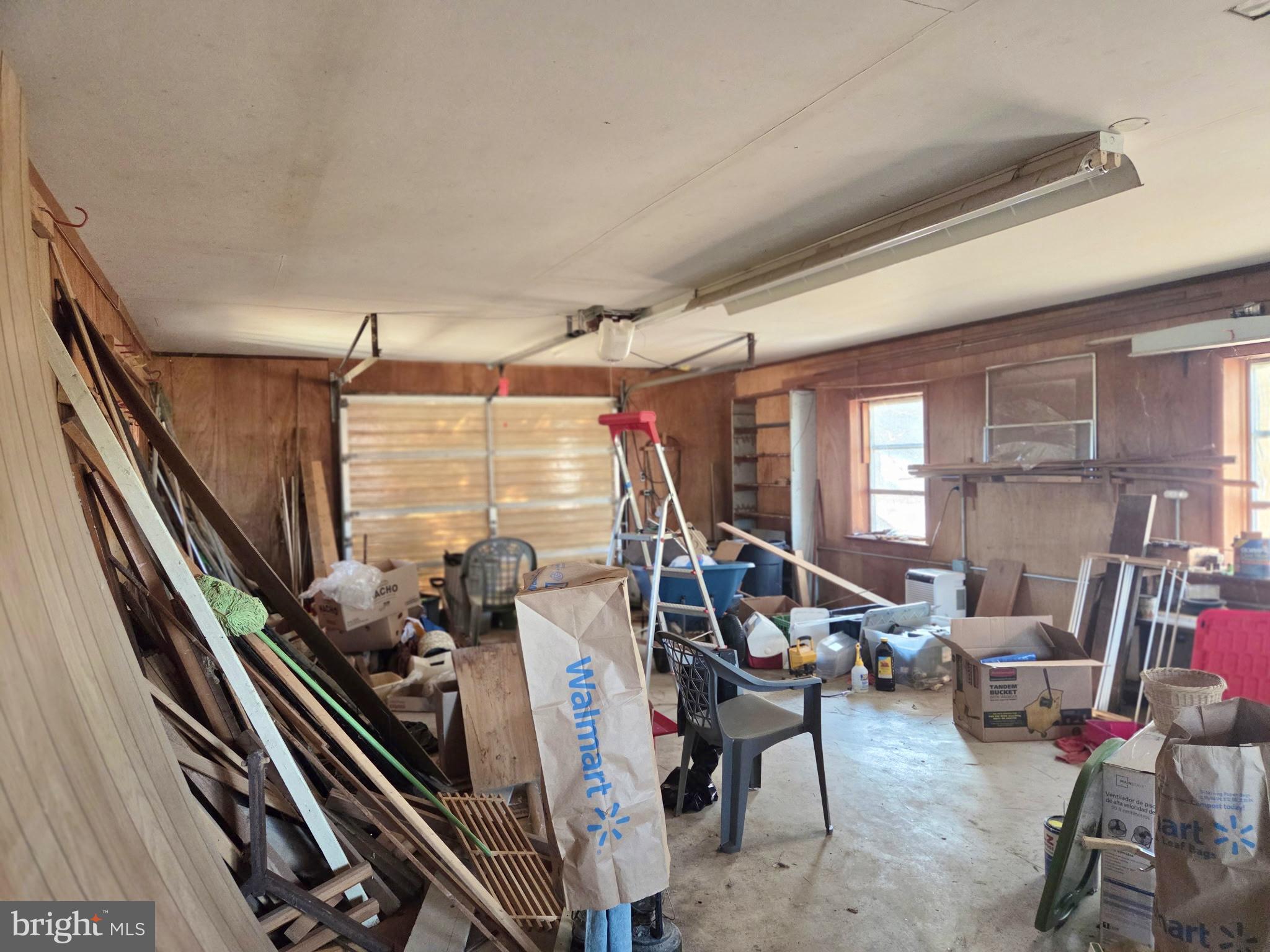 5489 Rude Avenue Tilghman, MD 21671 - Photo 40 of 65 a room with gym equipment and floor to ceiling windows