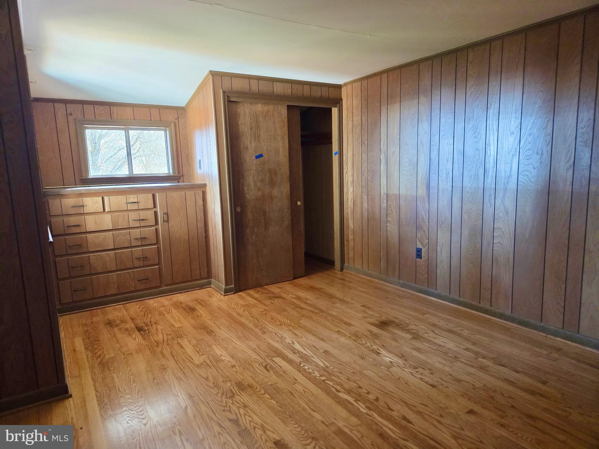 5489 Rude Avenue Tilghman, MD 21671 - Photo 41 of 65 a view of an empty room with wooden floor