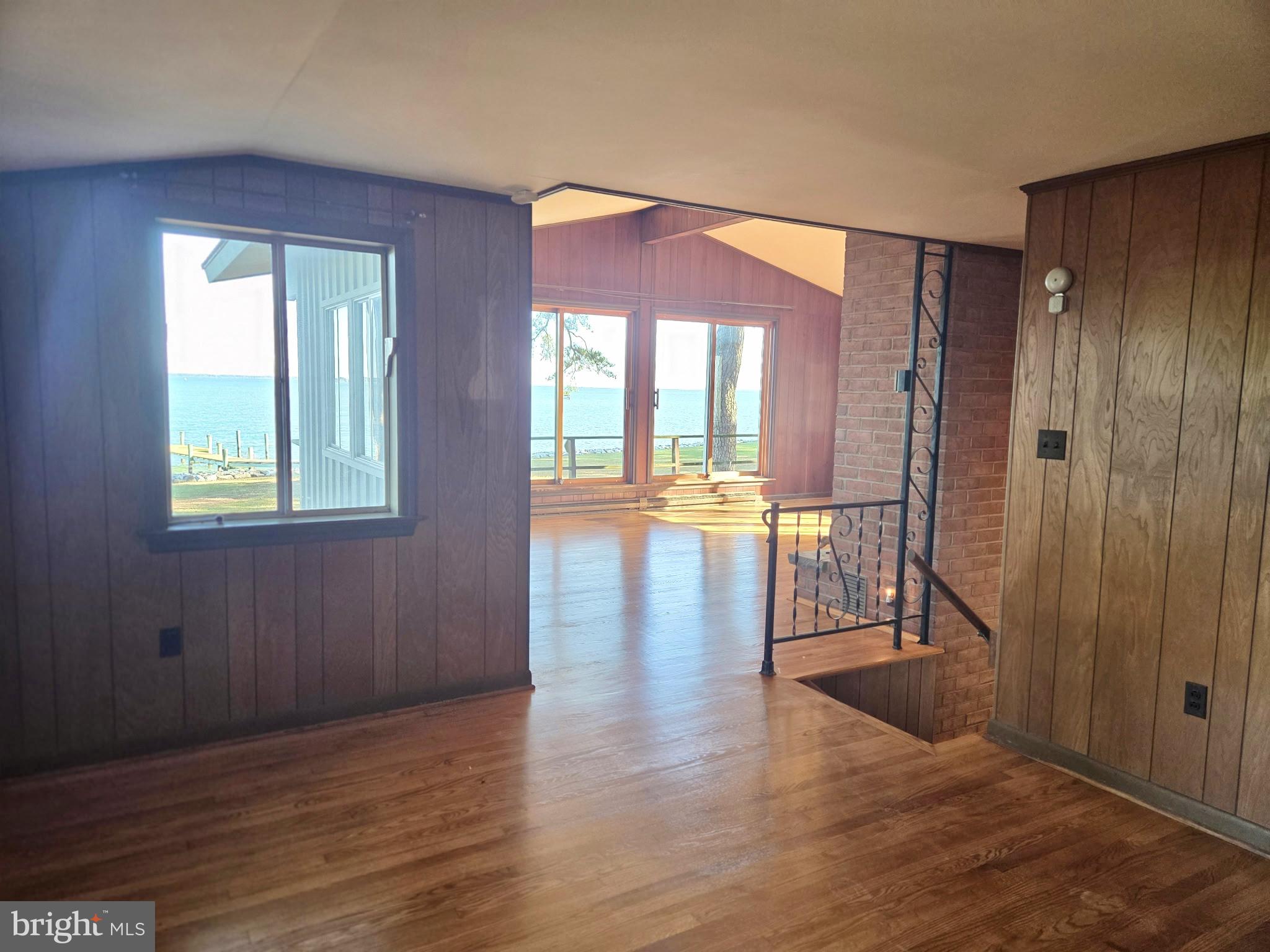 5489 Rude Avenue Tilghman, MD 21671 - Photo 42 of 65 a view of an entryway with wooden floor and a door