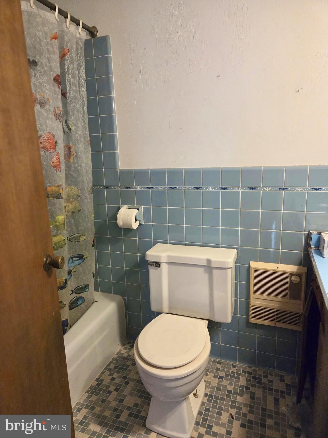 5489 Rude Avenue Tilghman, MD 21671 - Photo 49 of 65 a bathroom with a toilet and a shower