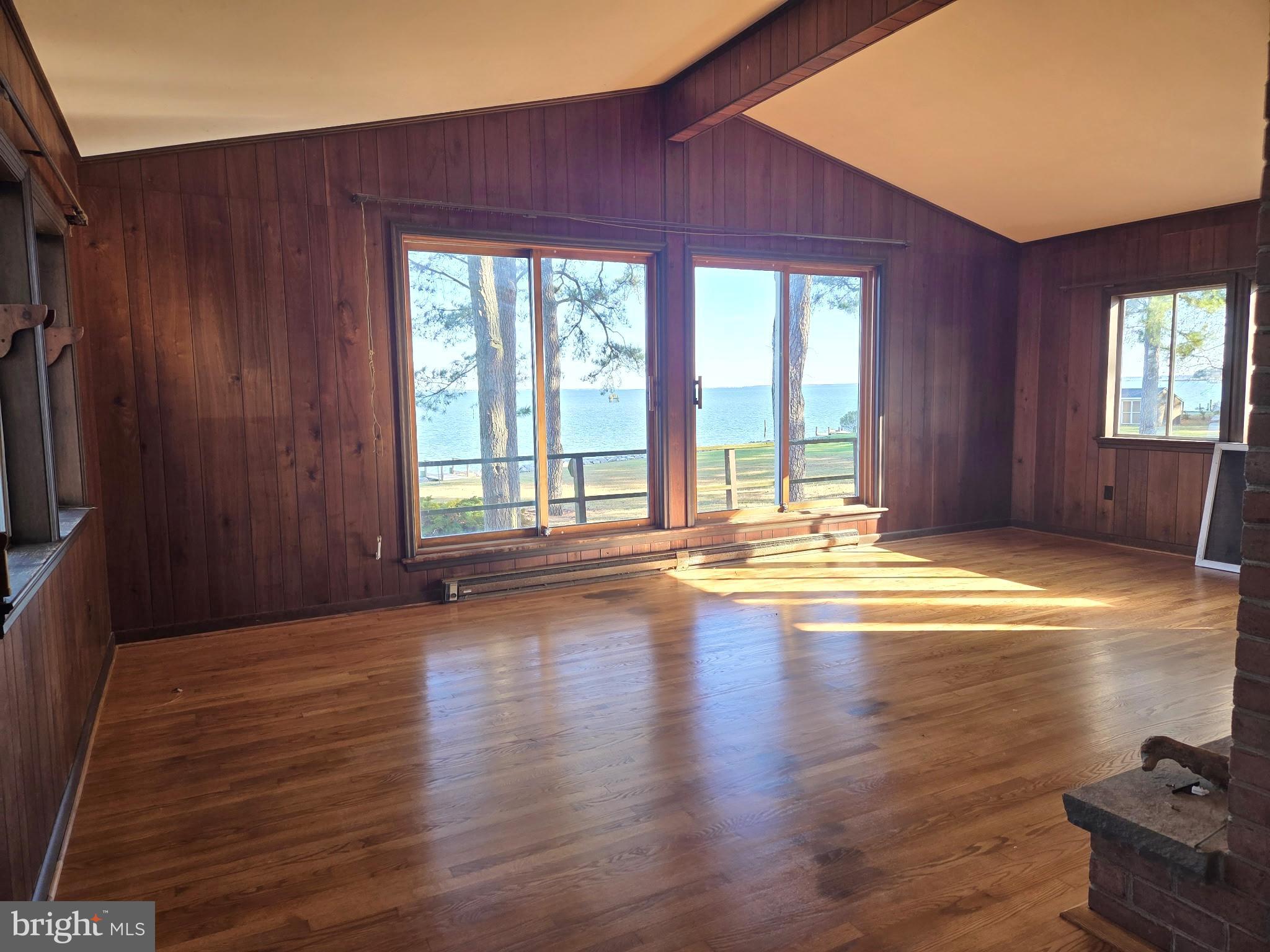 5489 Rude Avenue Tilghman, MD 21671 - Photo 54 of 65 a view of empty room with wooden floor and fan