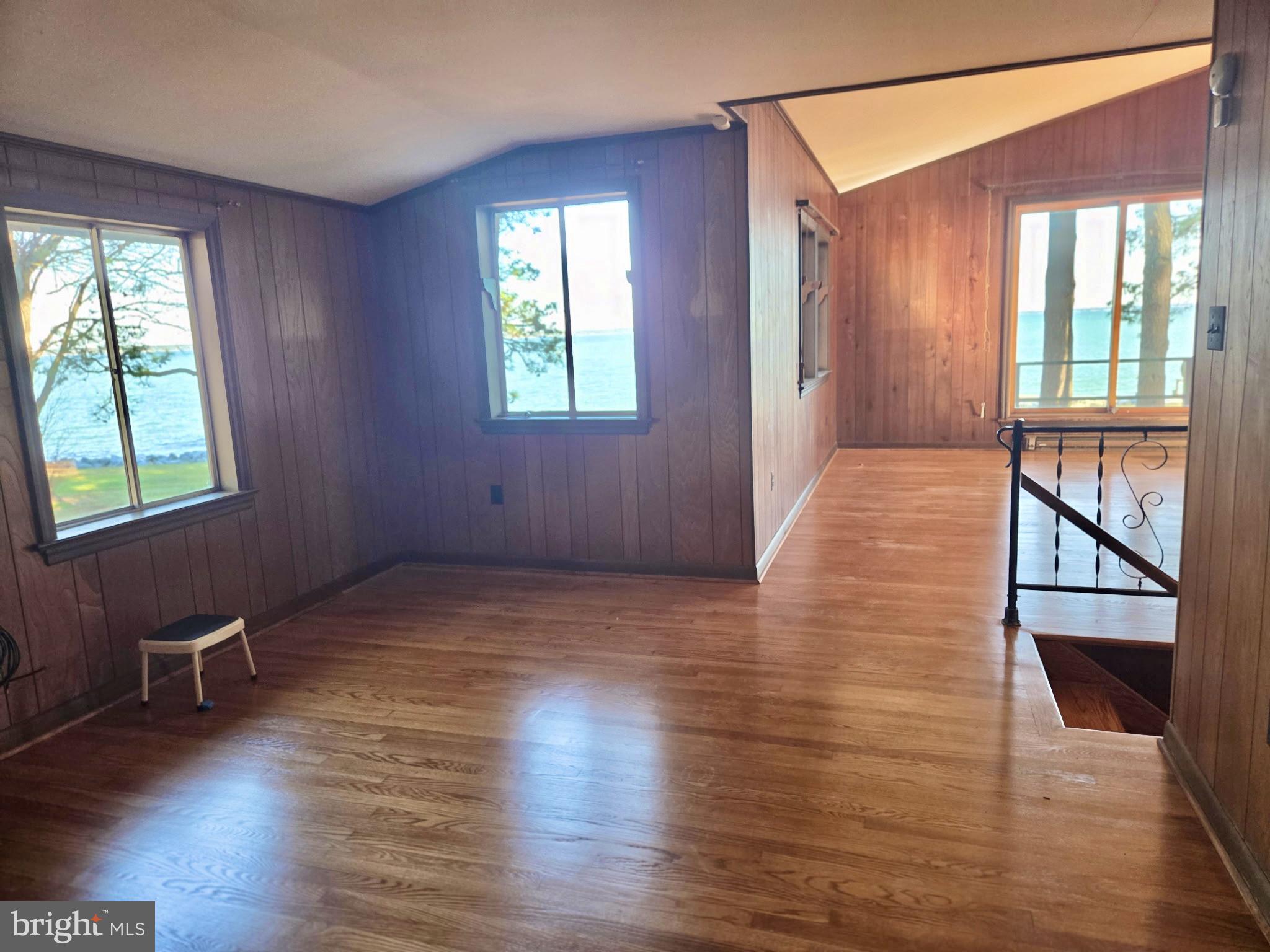 5489 Rude Avenue Tilghman, MD 21671 - Photo 55 of 65 a view of an empty room with wooden floor and a window