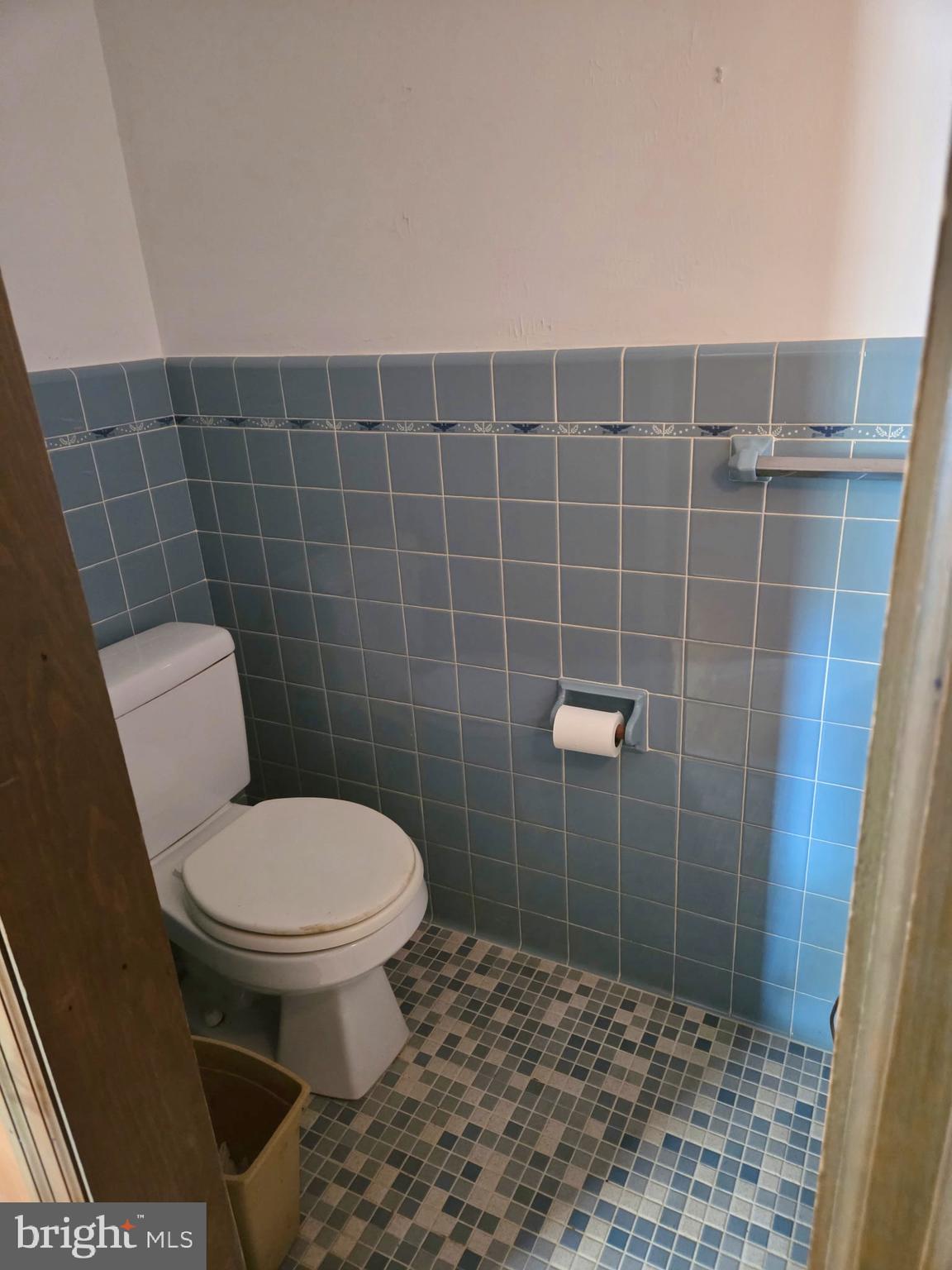 5489 Rude Avenue Tilghman, MD 21671 - Photo 57 of 65 a bathroom with a toilet and a shower