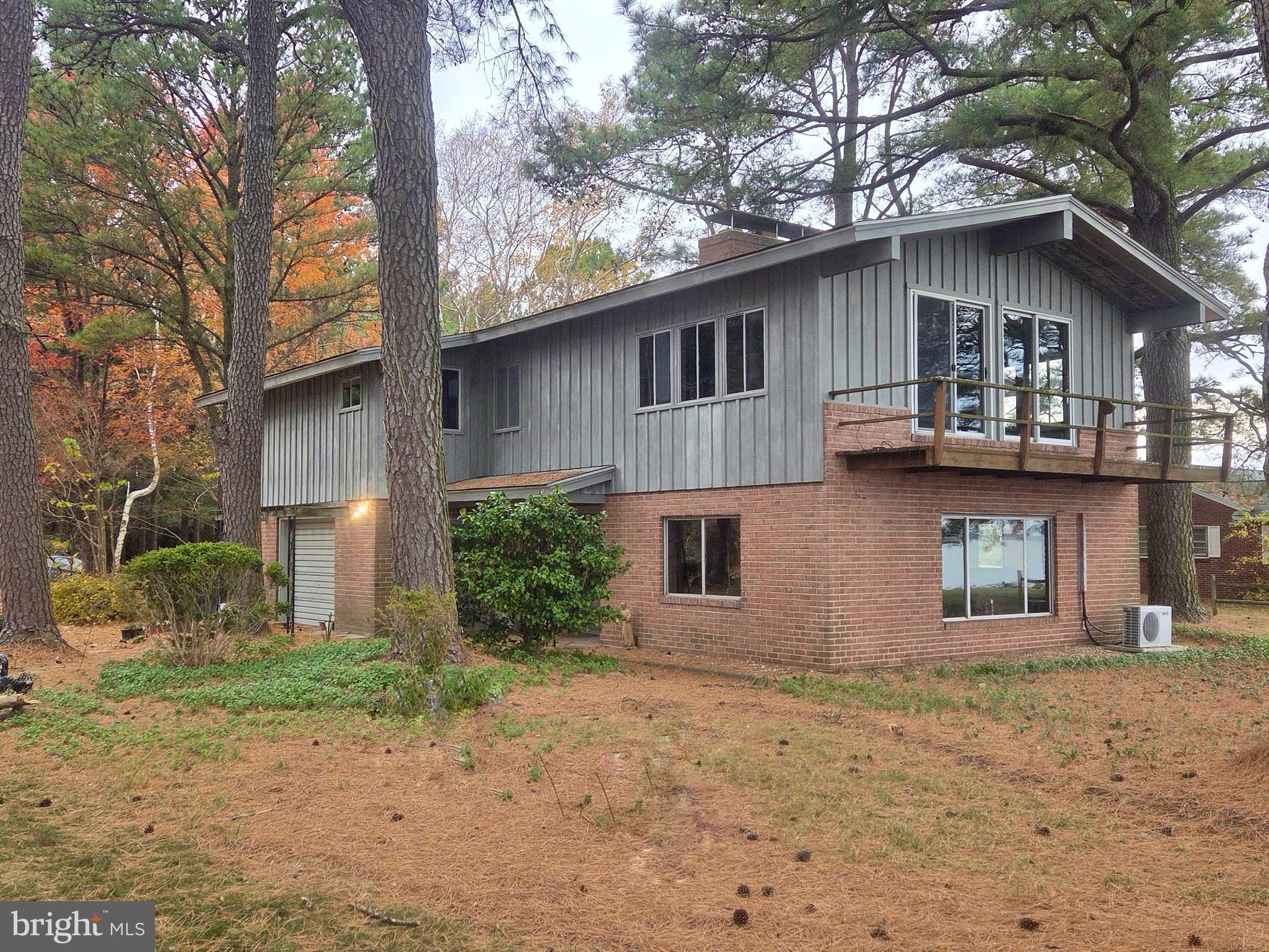 5489 Rude Avenue Tilghman, MD 21671 - Photo 6 of 65 a front view of a house with garden