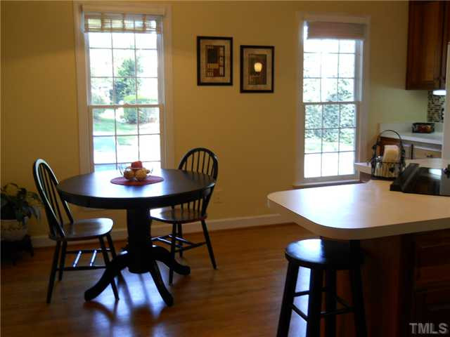2957 Tillinghast Trail Raleigh, NC 27613 - Photo 4 of 25 Another view of kitchen showing breakfast nook. Very light & bright with lots of windows.
