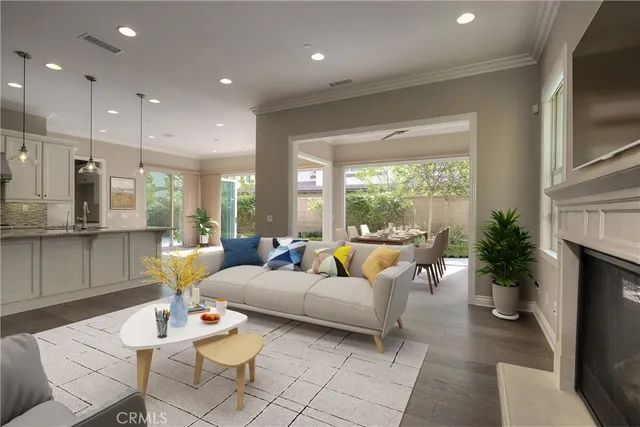 a living room with furniture fireplace and a large window