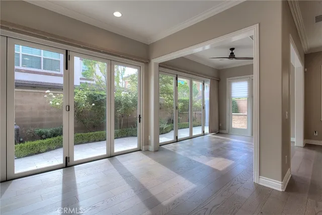a view of an empty room with a fireplace and a window