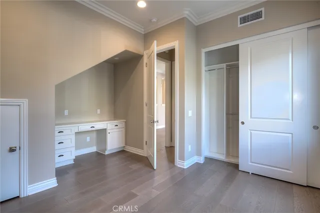 a view of staircase with wooden floor and windows