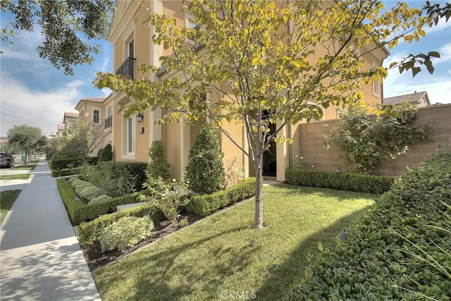 a view of a house with entertaining space and a tree