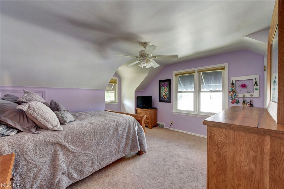 19646 Henry Road Fairview Park, OH 44126 - Photo 18 of 35 Carpeted bedroom with multiple windows.