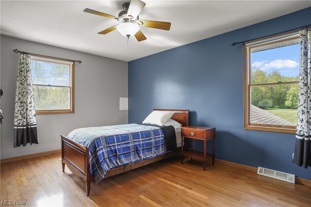 6885 Red Brush Road Ravenna, OH 44266 - Photo 30 of 35 3rd Bedroom at rear of home with original hardwood.