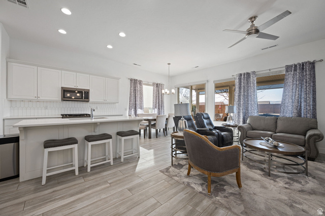 4708 Martin Drive St. George, UT 84790 - Photo 5 of 28 Living area featuring recessed lighting, a chandelier, ceiling fan, and light wood finished floors