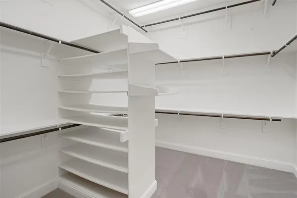 a view of an empty walk in closet