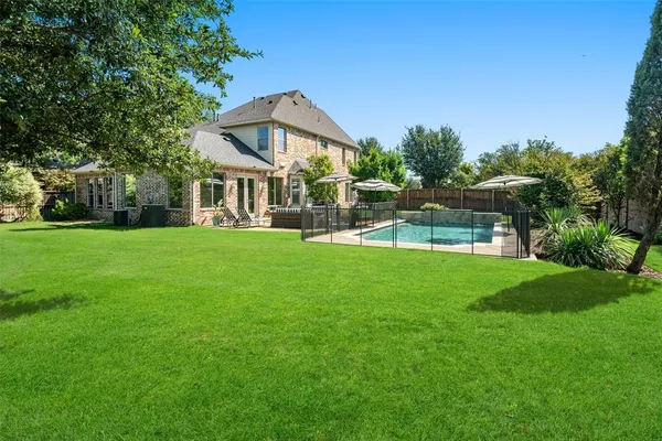 a view of a house with a big yard
