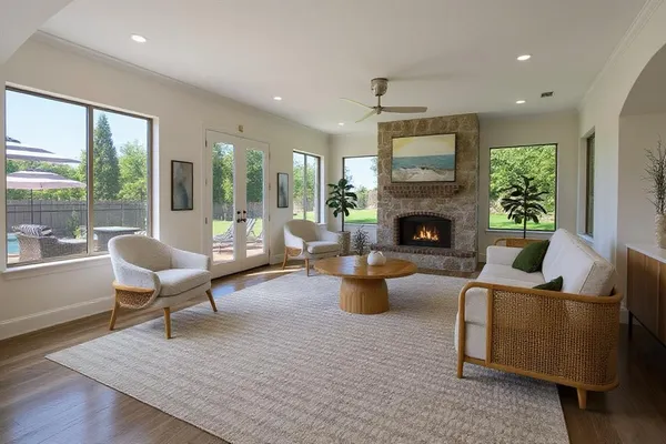 a living room with furniture fireplace and window