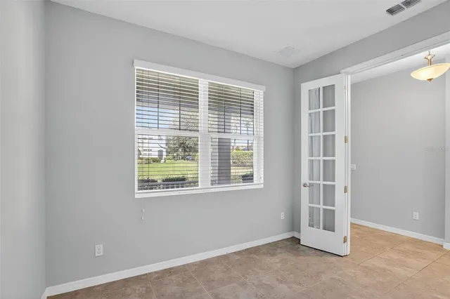 a view of an empty room with a window