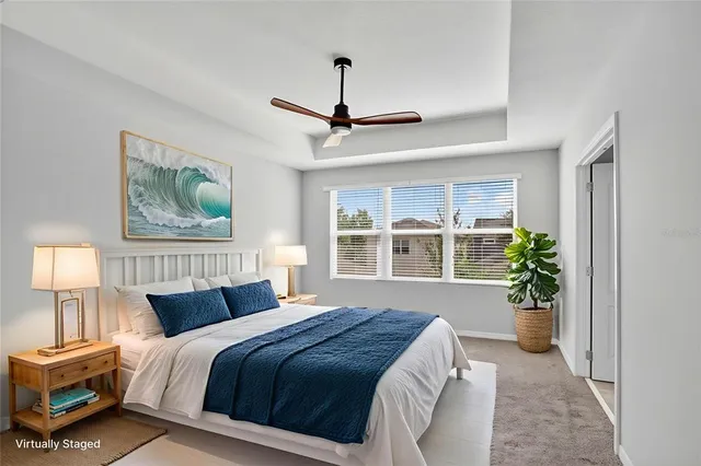a bedroom with a balcony a bed and a window