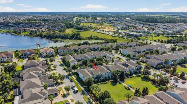 an aerial view of residential houses with outdoor space
