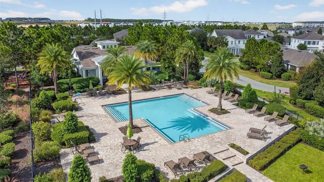 an aerial view of a house with a garden