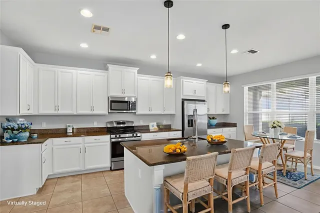 a kitchen with counter space appliances and cabinets