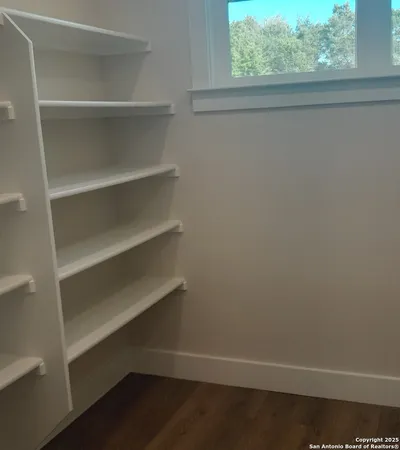 a view of an empty walk in closet