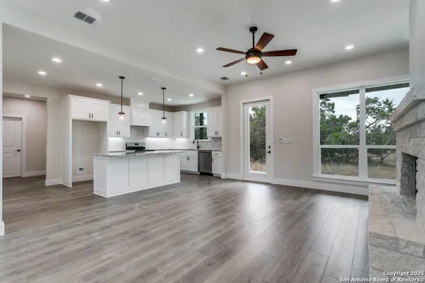 a view of kitchen with cabinets and stainless steel appliances
