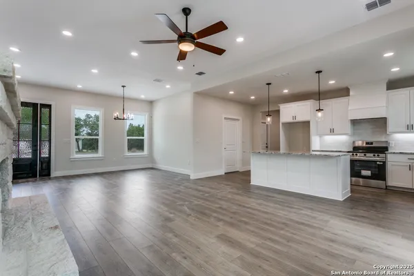 a view of kitchen with cabinets and stainless steel appliances