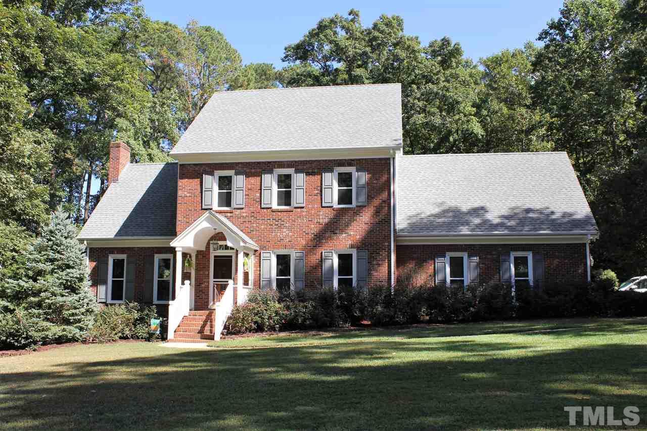 9504 Springdale Drive Raleigh, NC 27613 - Photo 1 of 25 a front view of a house with a yard