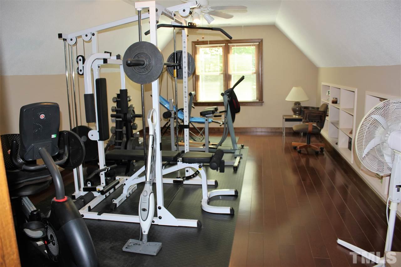 9504 Springdale Drive Raleigh, NC 27613 - Photo 17 of 25 a view of a room with gym equipment