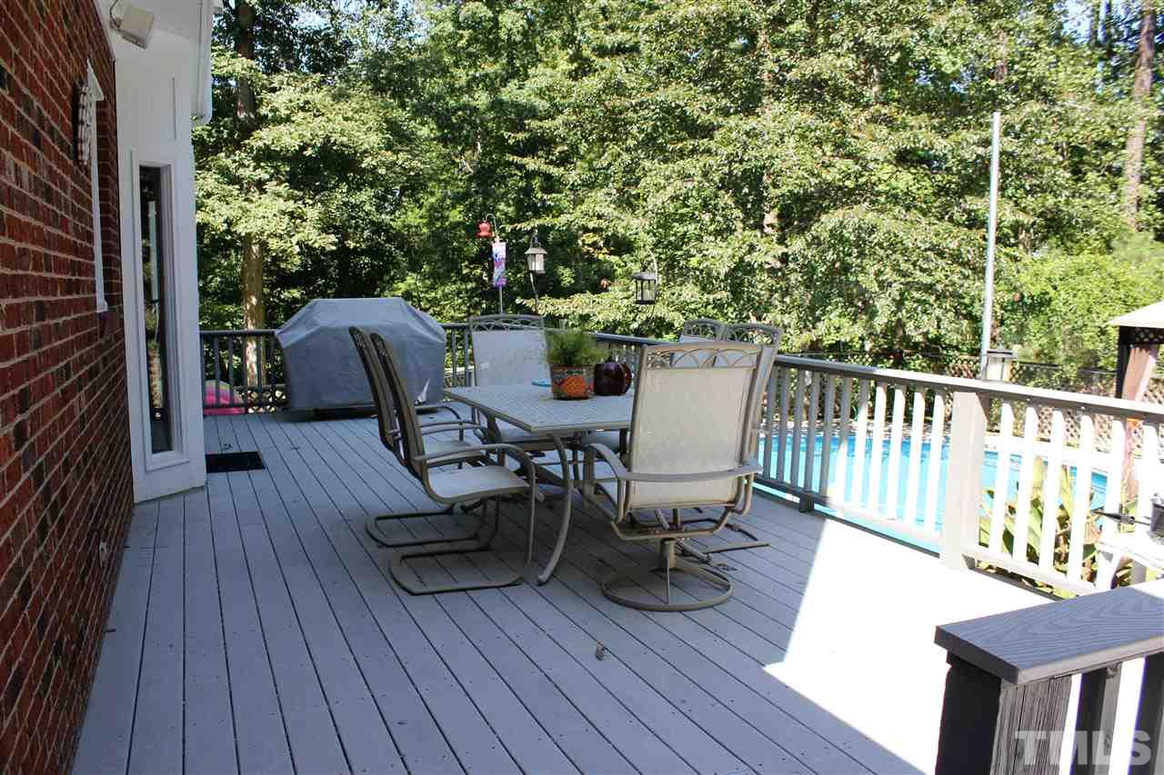 9504 Springdale Drive Raleigh, NC 27613 - Photo 18 of 25 a view of a chairs and table on the deck