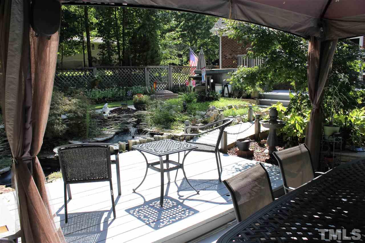 9504 Springdale Drive Raleigh, NC 27613 - Photo 22 of 25 a view of yard with patio