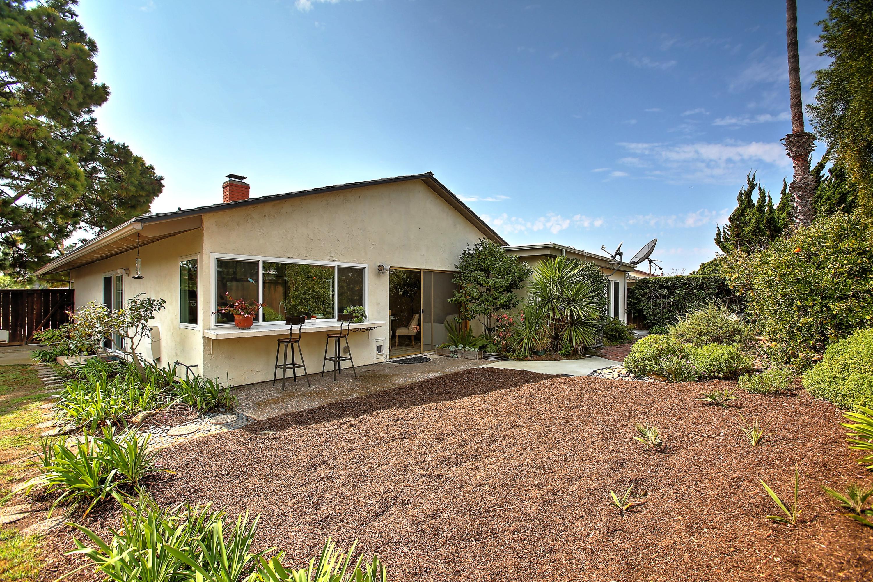 7206 Georgetown Road Goleta, CA 93117 - Photo 23 of 34 a front view of a house with a yard and porch