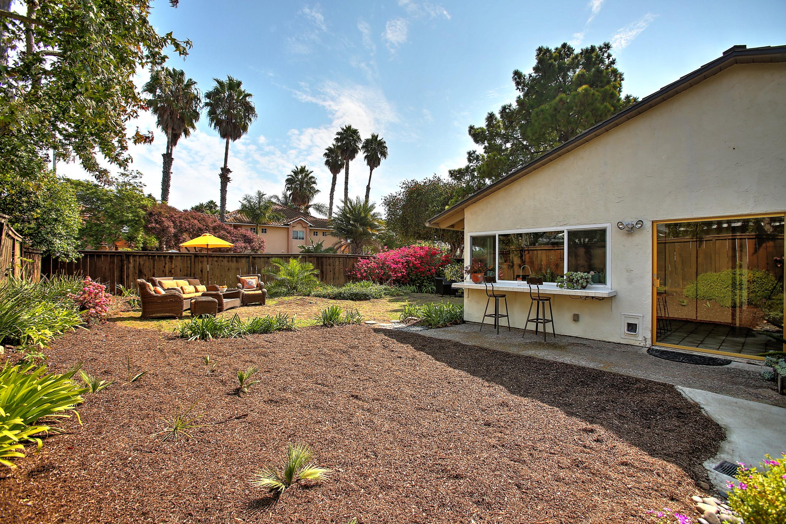 7206 Georgetown Road Goleta, CA 93117 - Photo 26 of 34 a view of a house with backyard sitting area and garden