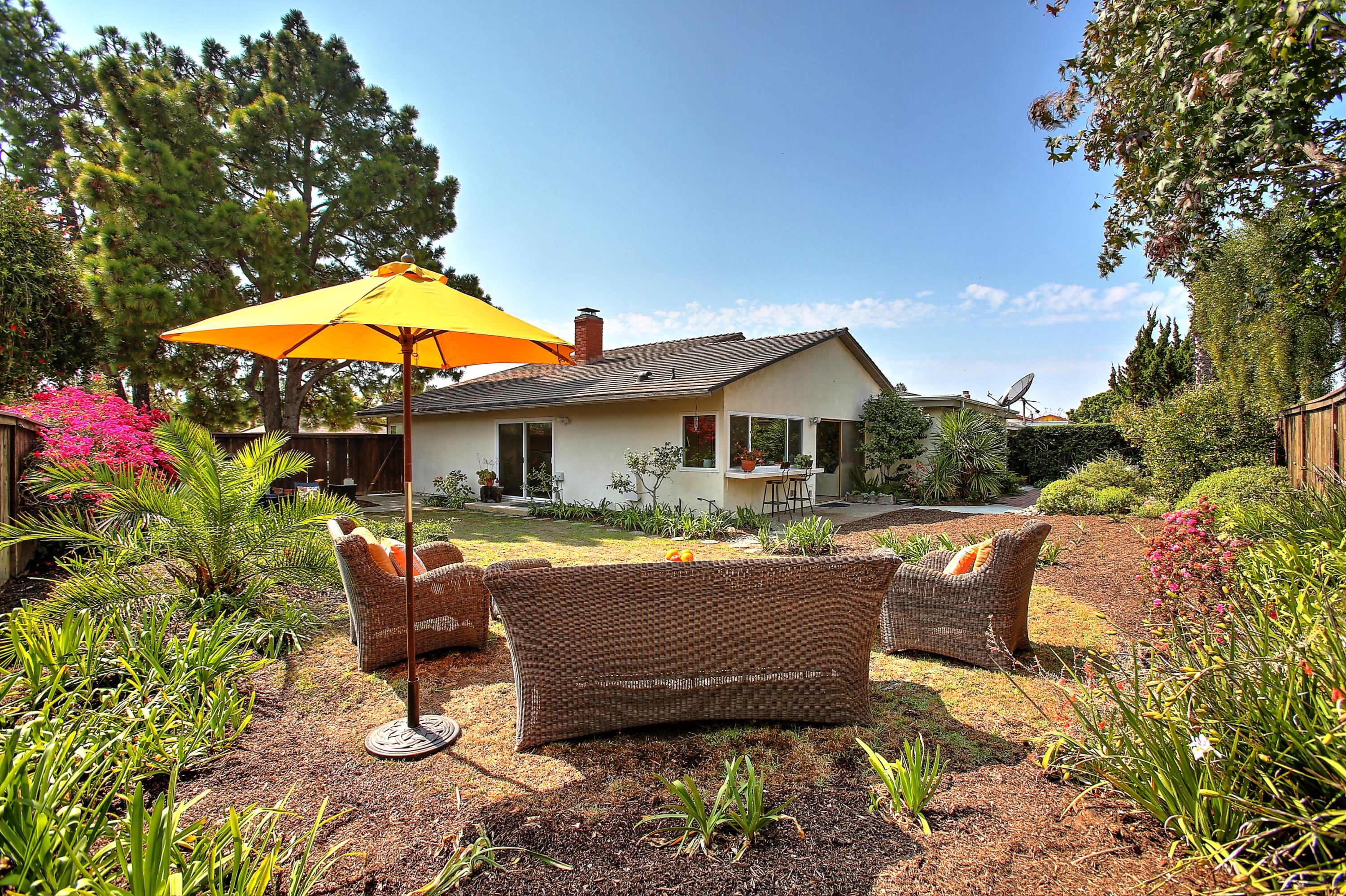 7206 Georgetown Road Goleta, CA 93117 - Photo 28 of 34 a view of a house with backyard sitting area and swimming pool