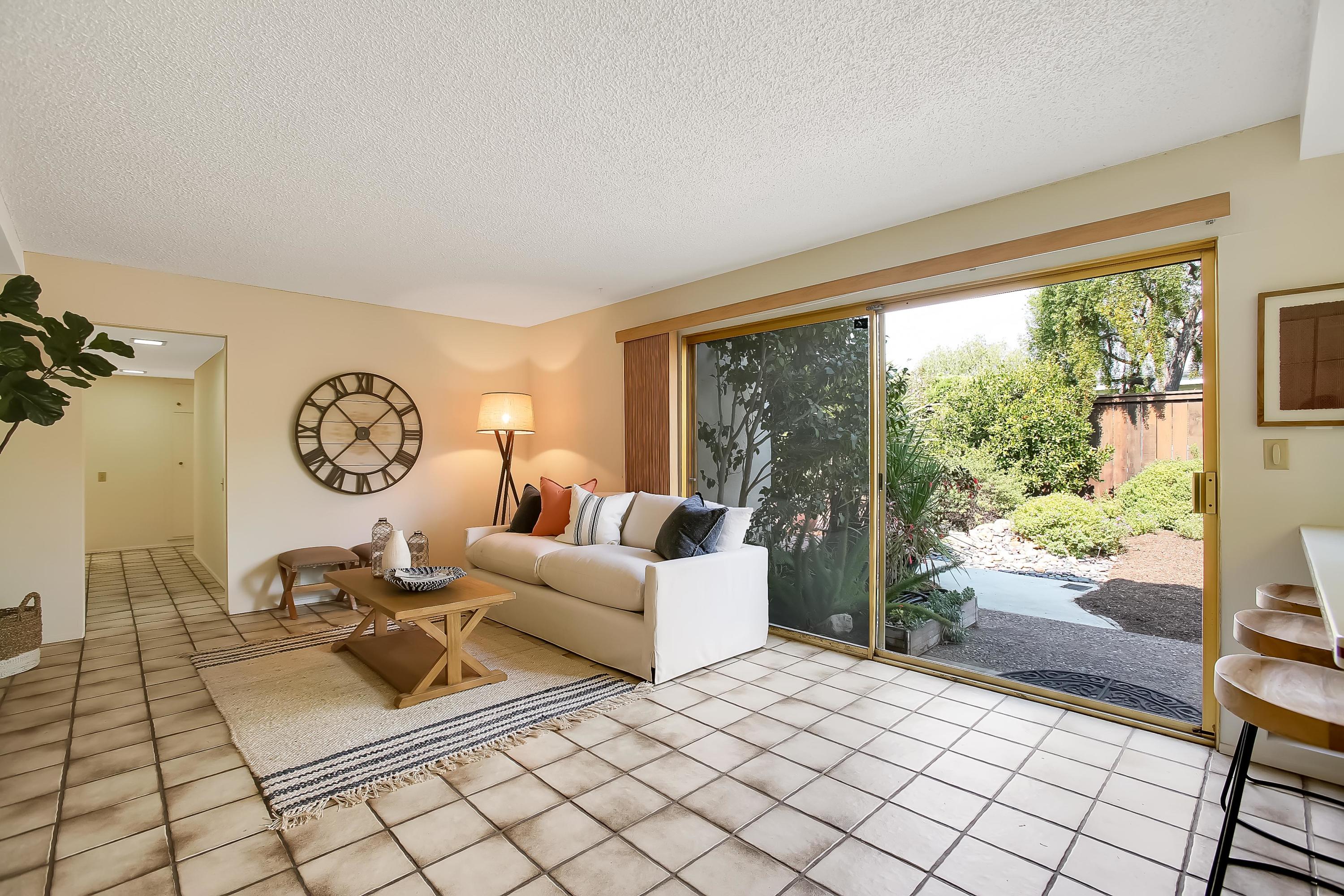 7206 Georgetown Road Goleta, CA 93117 - Photo 8 of 34 a living room with furniture a table and a large window