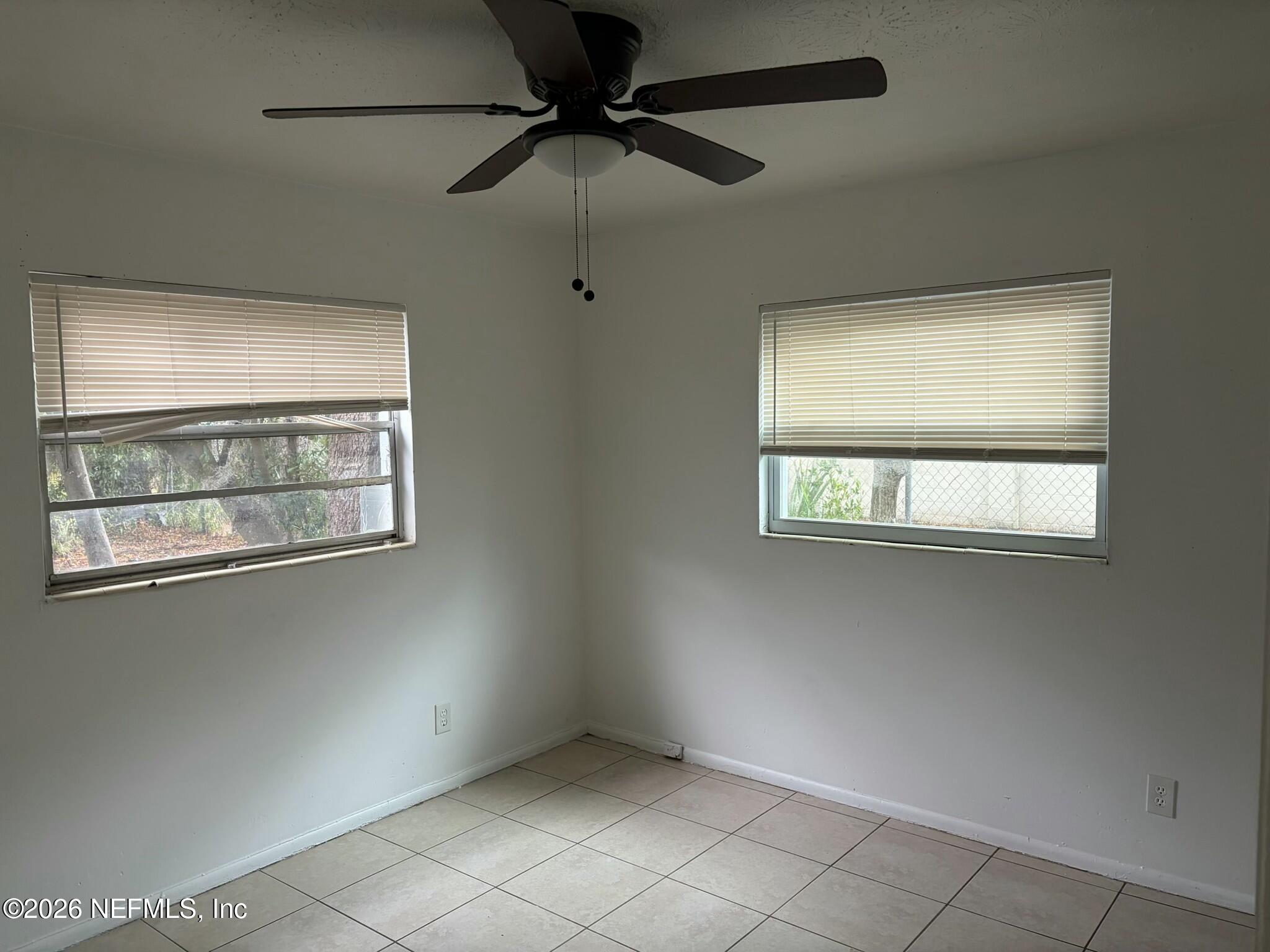 1040 Bert Road, Unit 5 Jacksonville, FL 32211 - Photo 5 of 5 a view of an empty room with a window