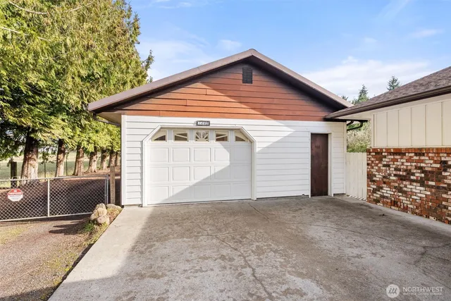 a front view of a house with a garage