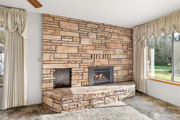 a living room with a couch and a fireplace
