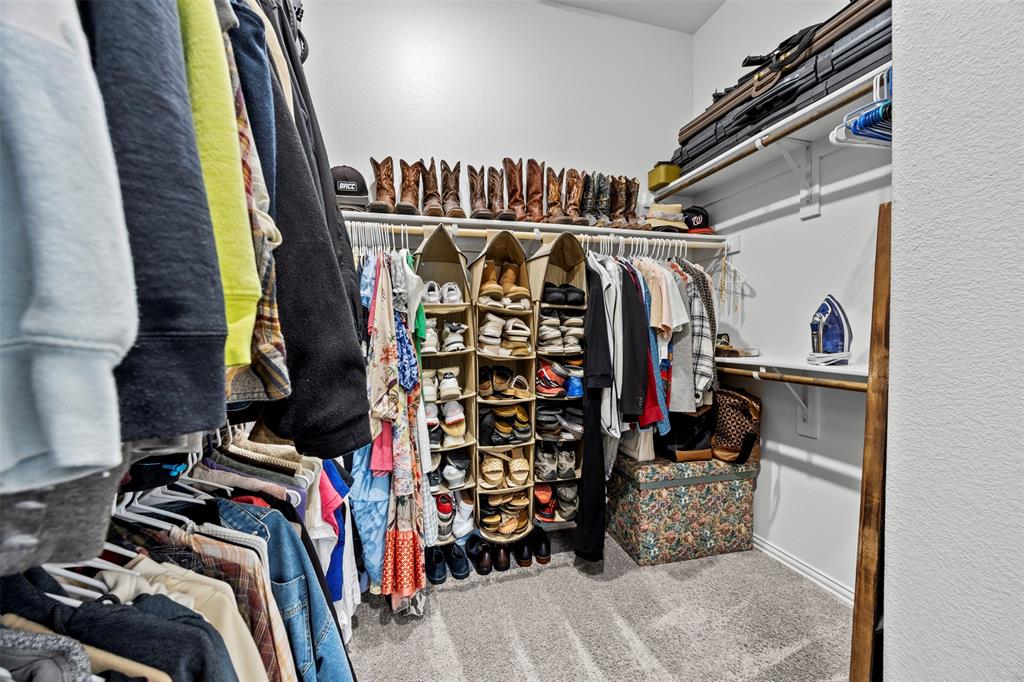 1084 Imperial Eagle Road Alvarado, TX 76009 - Photo 26 of 39 a view of walk in closet with clothes and shoes