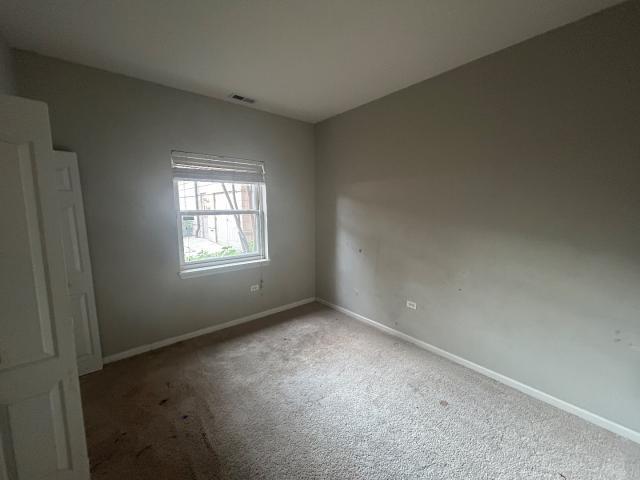 1461 South Halsted Street, Unit 1B Chicago, IL 60607 - Photo 12 of 20 an empty room with a window