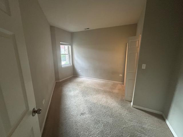 1461 South Halsted Street, Unit 1B Chicago, IL 60607 - Photo 15 of 20 an empty room with windows