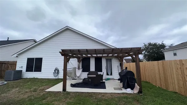 a backyard of a house with seating space