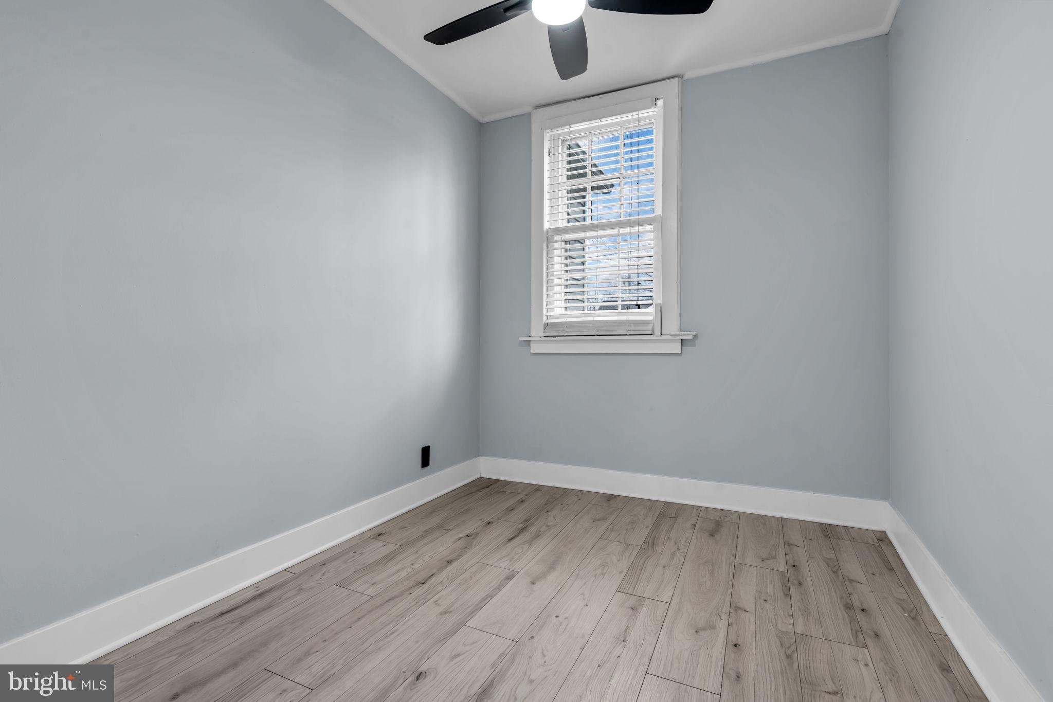 116 Hough Street Pemberton, NJ 08068 - Photo 13 of 25 an empty room with wooden floor and windows
