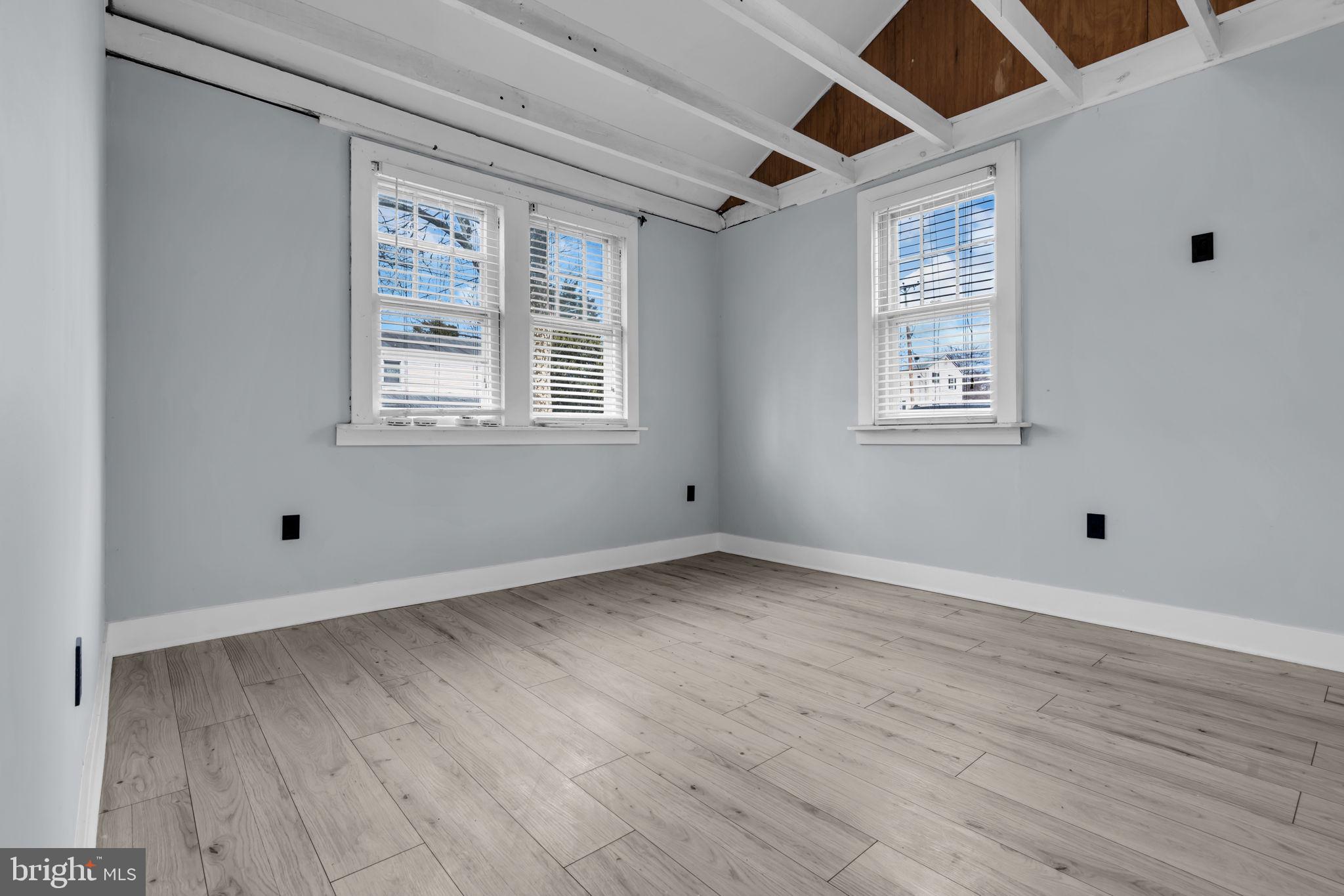 116 Hough Street Pemberton, NJ 08068 - Photo 14 of 25 a view of an empty room with wooden floor and a window